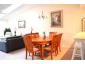 Dining room with a wooden table and six chairs at 8100 Memory Ln # 207, Rotonda West, FL 33947