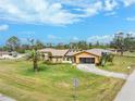 Beautiful single-Gathering home with a well-manicured lawn and a screened garage in a picturesque setting at 9822 Gulfstream Blvd, Englewood, FL 34224