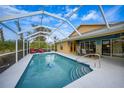 Inviting screened-in pool area, perfect for entertaining and relaxing outdoors at 215 Australian Dr, Rotonda West, FL 33947