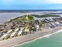 Stunning aerial view of the home, ocean, surrounding neighborhood, and waterfront access at 2805 N Beach Rd # B, Englewood, FL 34223