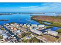 Aerial view showcases the property's prime waterfront location within a beautiful coastal community at 7180 Brittany Cir, Englewood, FL 34224