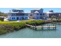 Beautiful waterfront coastal home with a private dock for boating, a luxurious waterfront lifestyle at 7180 Brittany Cir, Englewood, FL 34224