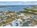 Aerial view of waterfront community with canals, docks, and easy Gulf access for boating and water activities at 10451 Sherman St, Englewood, FL 34224