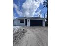 Charming single-story home featuring a two-car garage and modern design at 2814 Vogler Ln, North Port, FL 34286