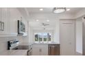 Modern white kitchen featuring stainless steel appliances, updated cabinets and countertops with a bright, open view at 11000 Placida Rd # 301, Placida, FL 33946