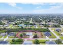 Stunning aerial view of the property showcasing its location within a peaceful residential neighborhood at 10307 Grail Ave, Englewood, FL 34224