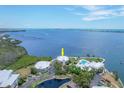 Gorgeous aerial view of the waterfront community with stunning water views and a swimming pool at 11000 Placida Rd # 101, Placida, FL 33946