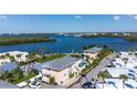 Beautiful waterfront property with lush landscaping, a private pool, and stunning views of the bay at 2375 N Beach Rd # 2B, Englewood, FL 34223