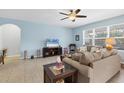 Spacious living room featuring neutral walls, tile floors and ample natural light at 15081 Aldama Cir, Port Charlotte, FL 33981