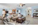 Cozy living room featuring tile floors, an open floor plan and eat-in kitchen at 15081 Aldama Cir, Port Charlotte, FL 33981