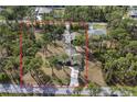 Expansive property with mature trees and a long driveway, offering privacy at 3892 Alwood St, North Port, FL 34291
