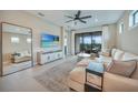 Bright living room with tile flooring, modern decor, and sliding doors to the patio at 6237 Fish Eagle Ct, Nokomis, FL 34275