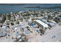 Aerial view of neighborhood, highlighting home's location to the beach and surrounding community at 40 Sand Dollar Ln, Englewood, FL 34223