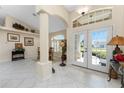 Open foyer with tile flooring, soaring ceilings, and views of the dining and entry way at 42 Medalist Ln, Rotonda West, FL 33947