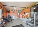 Spacious garage featuring unique decor and ample room for recreation and storage at 5703 Holiday Park Blvd, North Port, FL 34287
