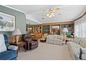 Comfortable living room featuring classic furniture and a built-in display cabinet at 5703 Holiday Park Blvd, North Port, FL 34287