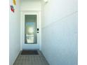 Inviting entryway features a tiled floor, glass door, and textured walls at 2255 N Beach Rd # 13, Englewood, FL 34223