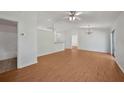 The expansive living room features stylish floors, abundant natural light, and a ceiling fan at 2495 De Garmo St, North Port, FL 34291