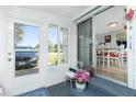 Cozy sunroom with sliding glass doors, offering natural light and indoor/outdoor living at 3220 Holly Ave, Englewood, FL 34224