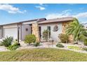 Charming single-story home with landscaped yard and stone accents at 613 Chestnut Ln, Englewood, FL 34223