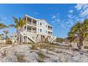 Beautiful multi-story beach house featuring spacious balconies and direct access to the sandy beach at 7430 Palm Island Dr # 3813, Placida, FL 33946