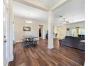 Open-concept living area with wood floors, ample natural light, and spacious layout at 9087 Hilliard Ter, Englewood, FL 34224