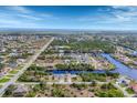 Stunning aerial view of a waterfront community with winding canals and beautiful homes at 9460 Migue Cir, Port Charlotte, FL 33981