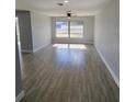 Bright living room featuring tile flooring, large windows, and modern neutral paint at 1247 Price Nw Cir, Port Charlotte, FL 33948