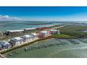Stunning aerial view of waterfront condo community with boat docks along the canal at 1410 Beach Rd # 201, Englewood, FL 34223