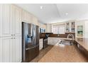 Well-equipped kitchen with stainless steel appliances, granite counters, and ample cabinet space at 1410 Beach Rd # 201, Englewood, FL 34223
