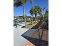 Waterfront property featuring a boat dock, canal access, and walkway at 14970 Appleton Blvd, Port Charlotte, FL 33981