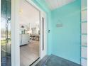 Inviting entryway with bright blue accent wall and decorative tile flooring at 15652 Ruston Cir, Port Charlotte, FL 33981