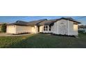 Beautiful single-story home boasting manicured lawn and decorative stone facade at 172 Coblentz St, Port Charlotte, FL 33954