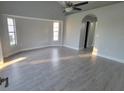 Spacious living room featuring hard surface floors, recessed lighting, and bay windows at 172 Coblentz St, Port Charlotte, FL 33954