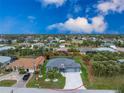 An aerial view of the charming single-story home, revealing its location within a peaceful residential area at 59 Long Meadow Ln, Rotonda West, FL 33947