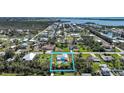 Aerial view of property with inviting backyard pool and canal access to the Intracoastal Waterway at 8164 Archie St, Englewood, FL 34224