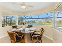 A breakfast nook surrounded by windows overlooking water views at 12 Sportsman Ter, Rotonda West, FL 33947