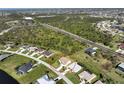 Wide aerial shot shows property with a circle around it, highlighting its location within the surrounding neighborhood at 127 White Marsh Ln, Rotonda West, FL 33947
