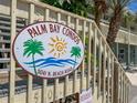 Palm Bay Condo sign at the front staircase with beach road address at 5041 N Beach Rd # 3A And 3B, Englewood, FL 34223