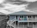 Coastal home with wraparound decks, perfect for enjoying water views and outdoor living at 7237 Rum Bay Dr # 5022, Placida, FL 33946