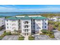 This is a great aerial view of the condo with a view of the ocean in the background at 9203 Griggs Rd # A204, Englewood, FL 34224
