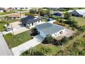 A charming single-Gathering home with a spacious driveway and well-maintained landscaping at 9265 Carnation Ave, Englewood, FL 34224