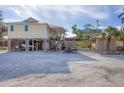 Coastal home on stilts with ample parking space for vehicles and boats and stairs to the beach at 97 Kettle Harbor Dr, Placida, FL 33946
