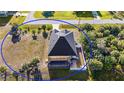 Aerial view showing fenced in yard with a screened in pool, lots of backyard privacy at 10498 Bay State Dr, Port Charlotte, FL 33981