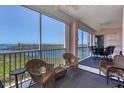 Relaxing balcony seating area with gorgeous water views at 13313 Gasparilla Rd # C501 & Slip 11, Placida, FL 33946