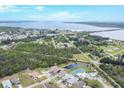 Expansive aerial view showcases the neighborhood's proximity to the water and lush green spaces at 14281 Palm Ter, Port Charlotte, FL 33953