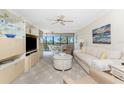 Comfortable living room featuring stylish furnishings, bright windows, and serene waterfront views at 1651 Beach Rd # 311, Englewood, FL 34223