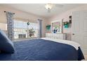 Comfortable bedroom featuring a bright window and nice decor at 202 Silver Lake Dr # 203, Venice, FL 34292