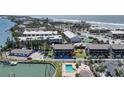 Condo exterior with a pool and water access in a convenient beachside location at 2727 N Beach Rd # 113, Englewood, FL 34223