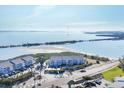Beautiful aerial shot of waterfront condos, highlighting beach access and tranquil ocean backdrop at 6000 Boca Grande Cswy # D38, Boca Grande, FL 33921